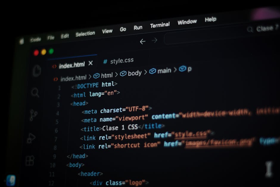 Close-up image of a computer screen displaying lines of programming code with syntax highlighting in green, red, blue, and white text on a black background. The code appears to be part of a software d